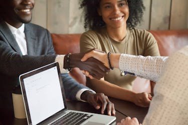 Handshake - couple invest their savings to start a business