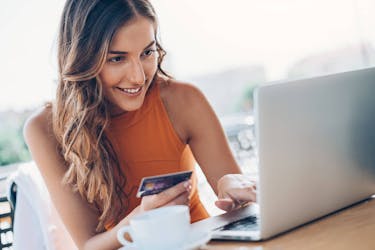 Young woman checking her credit balance