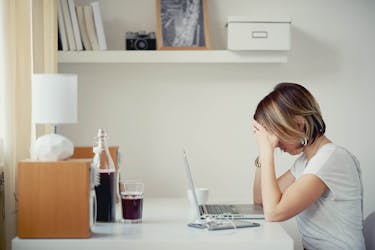 Woman researching income protection insurance on the computer