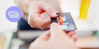 Customer handing a cashier a credit card