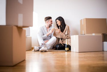 Couple celebrating a purchase of their first home