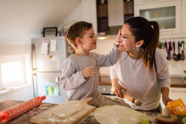 Child and mother having fun in newly purchased house