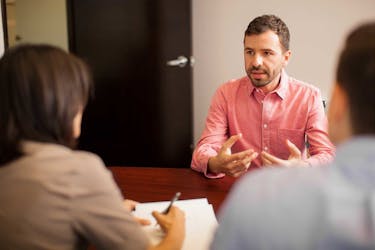 man teaches couple how to negotiate a commercial lease agreement