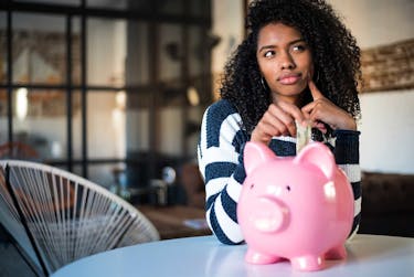 Woman thinking about how much she should save each month