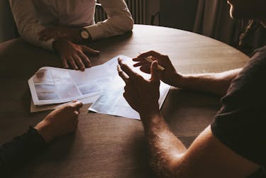 3 men discussing their schedule and how to say no when dealing with supervisor requests