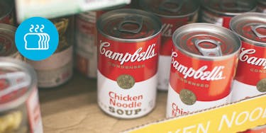 Campbell's chicken noodle soup in a box on a shelf in the grocery store