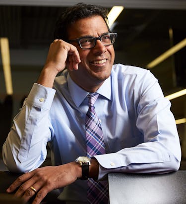 Atul Gawande smiling because he completed daily task by due date