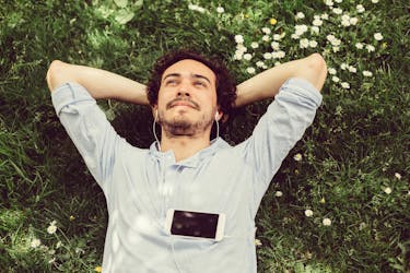 Man is meditating on the grass