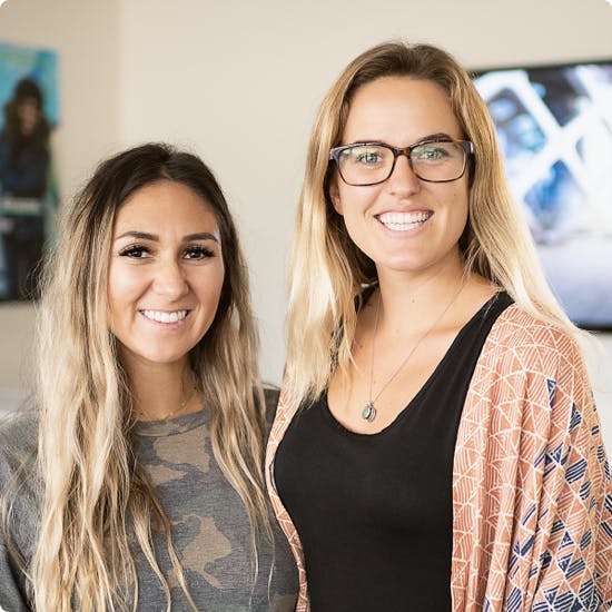 Two WealthFit customer service representatives