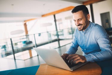 guy smiling as he leveraged real estate success