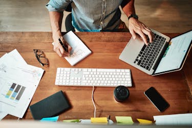 Man works productively on his laptop computer