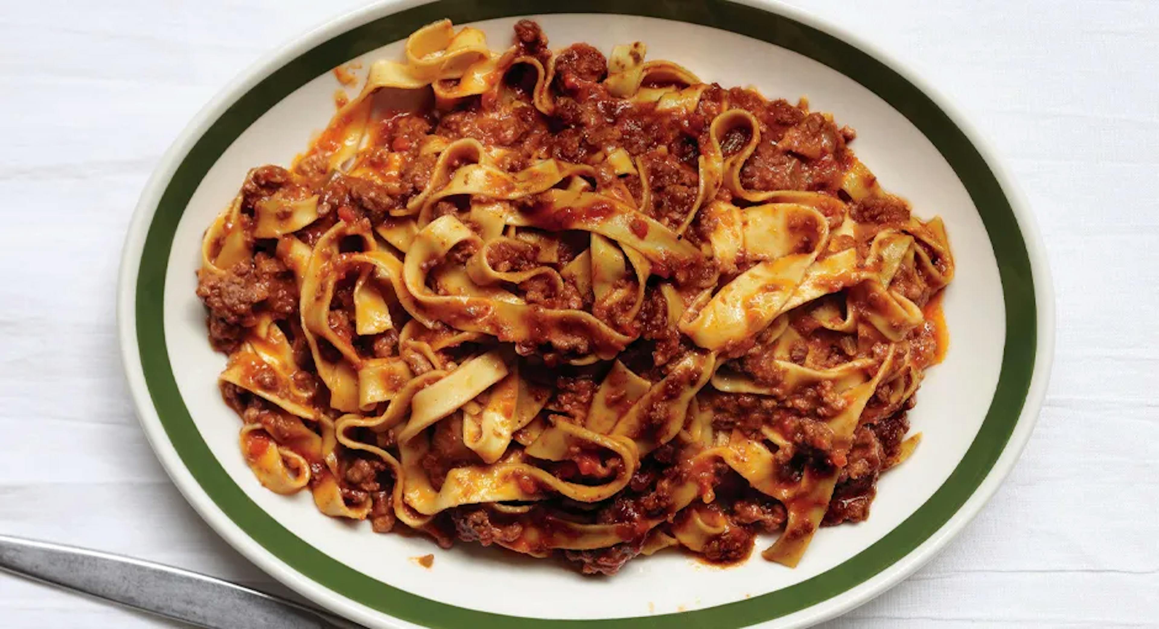 Ragu Bolognese is a rich and hearty Italian meat sauce that's perfect for coating pasta or as a filling for lasagna. To make this classic dish, start by finely chopping onions, carrots, and celery, known as the "soffritto," and sautéing them in a large pan with olive oil until they become soft and fragrant.