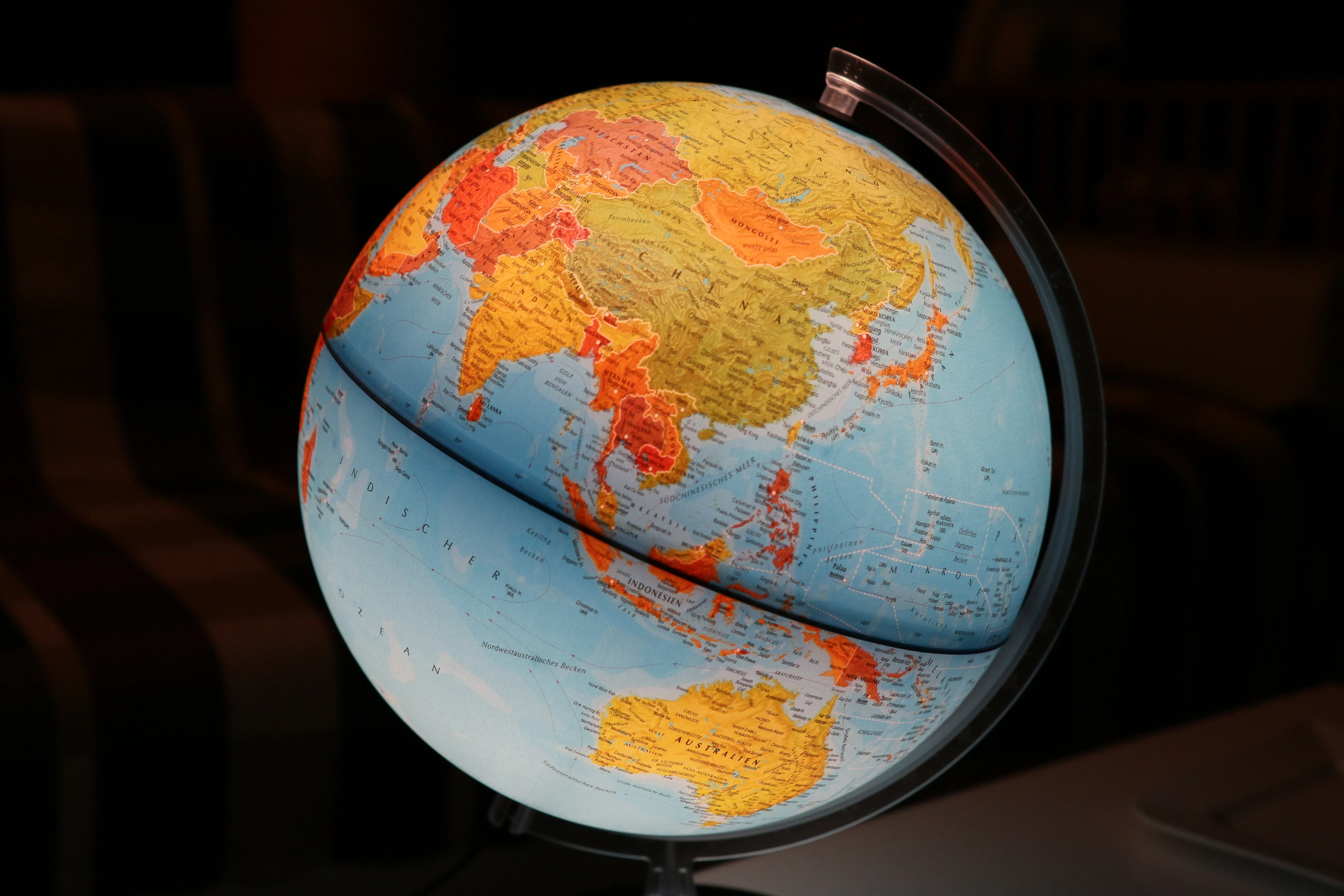 Close-up photo of a desk globe focused on Asia and Australia