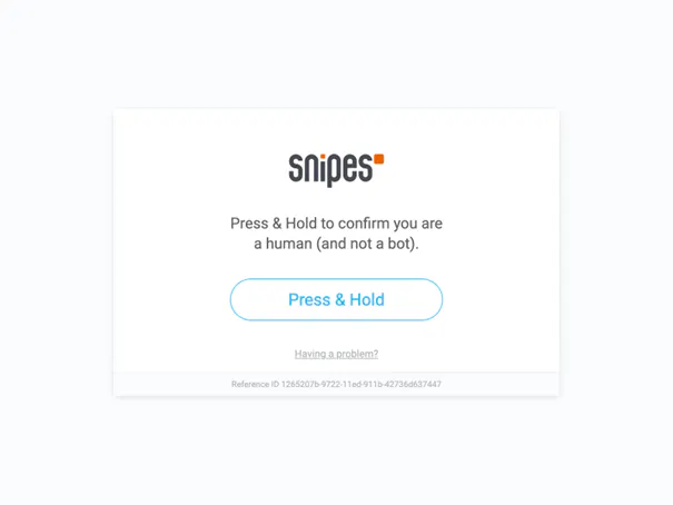 Bot protection challenge screen on the Snipes site asking the user to press and hold to confirm they are human
