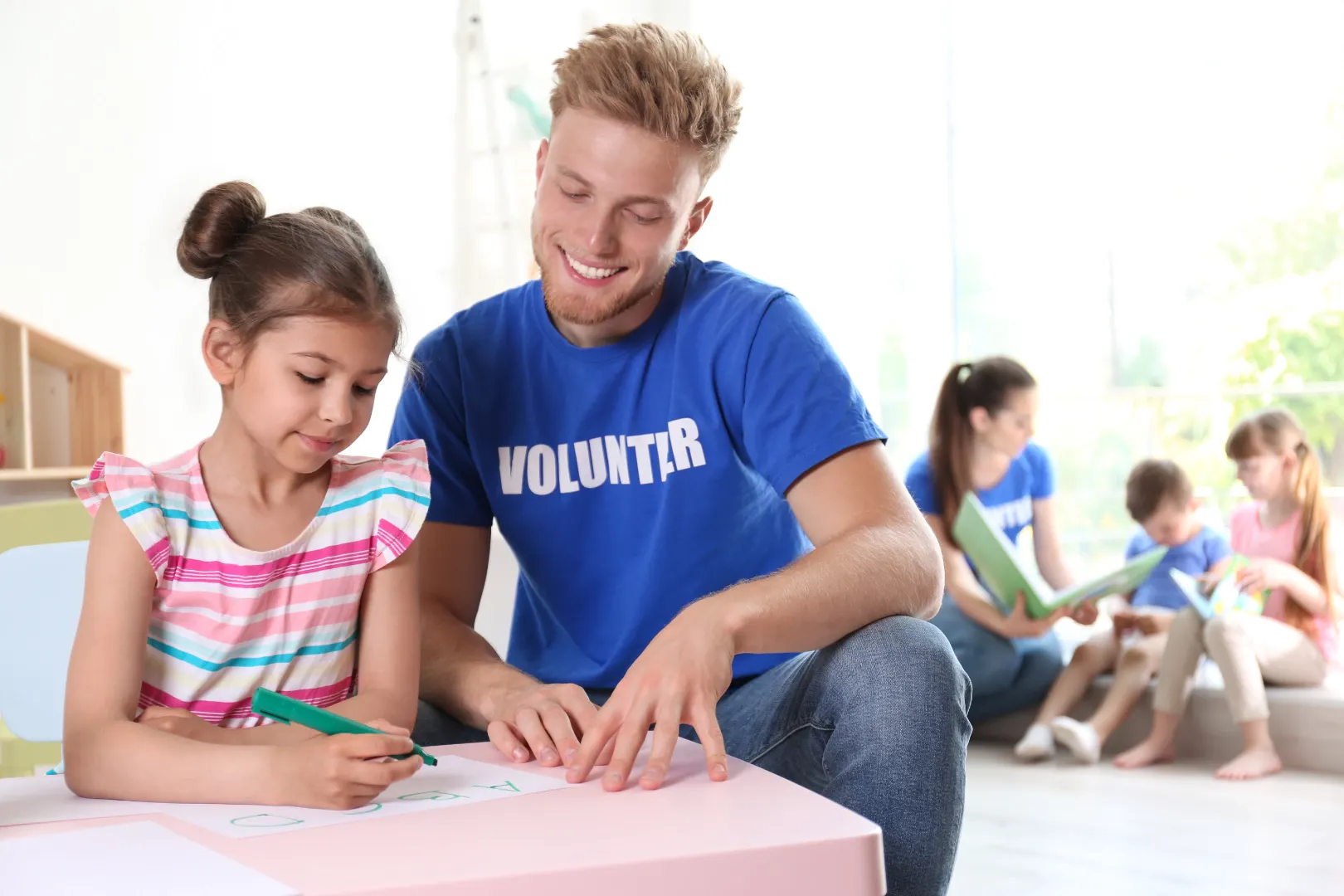 Volunteers may help in schools, assist teachers in classroom activities