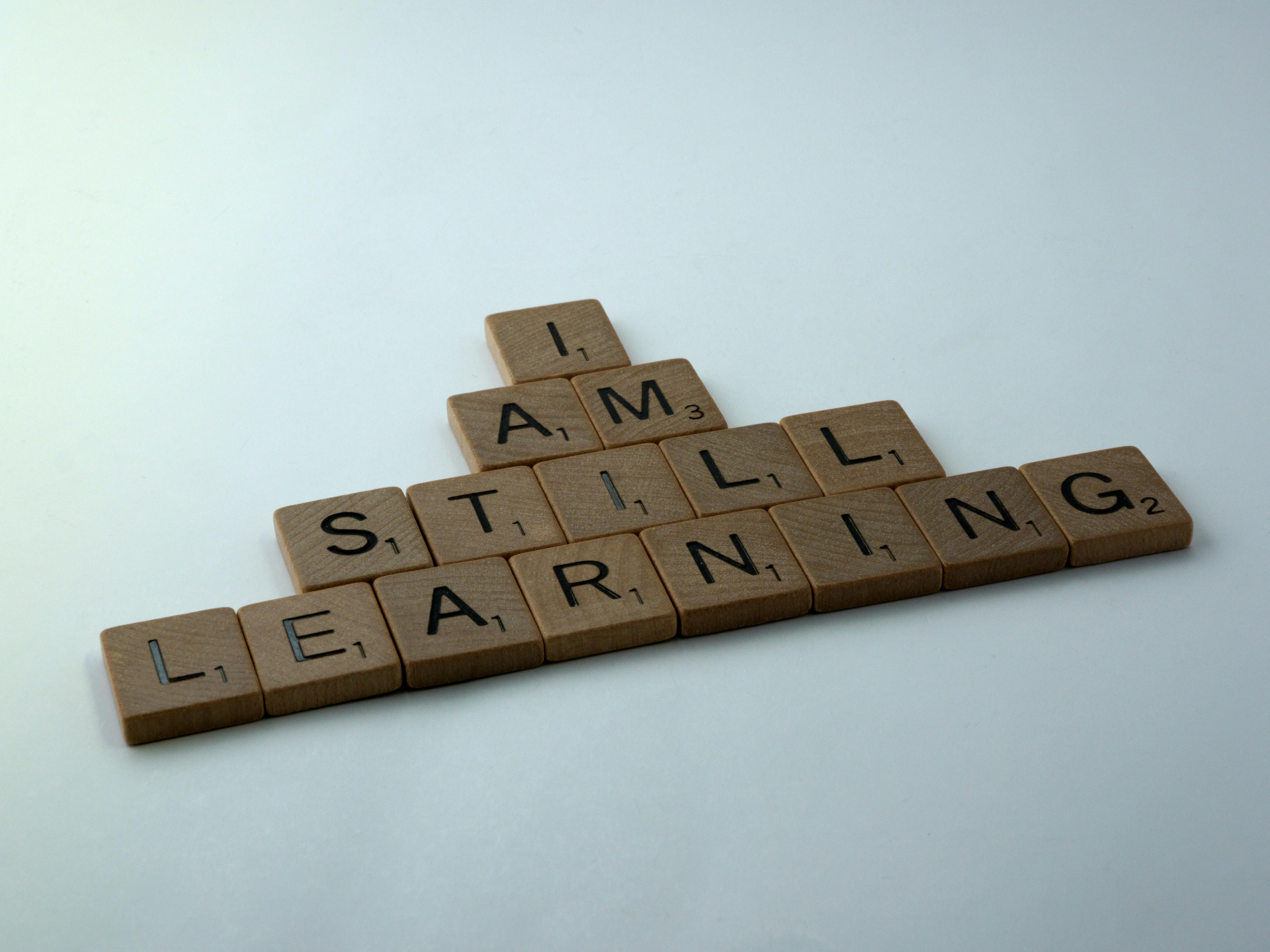 scrabble titles that spell out "I am still learning"
