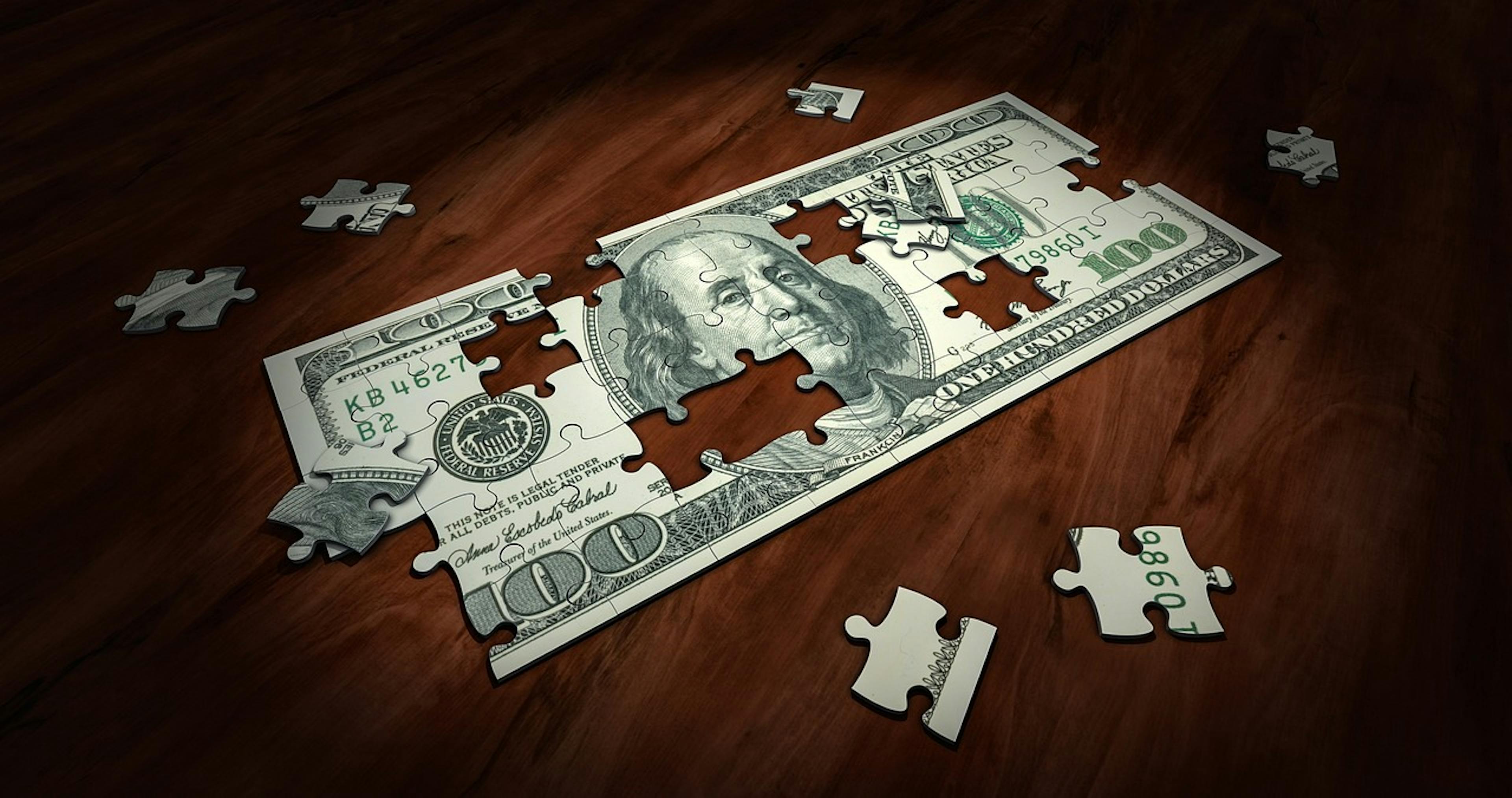 Nota de dolar em quebra-cabeça