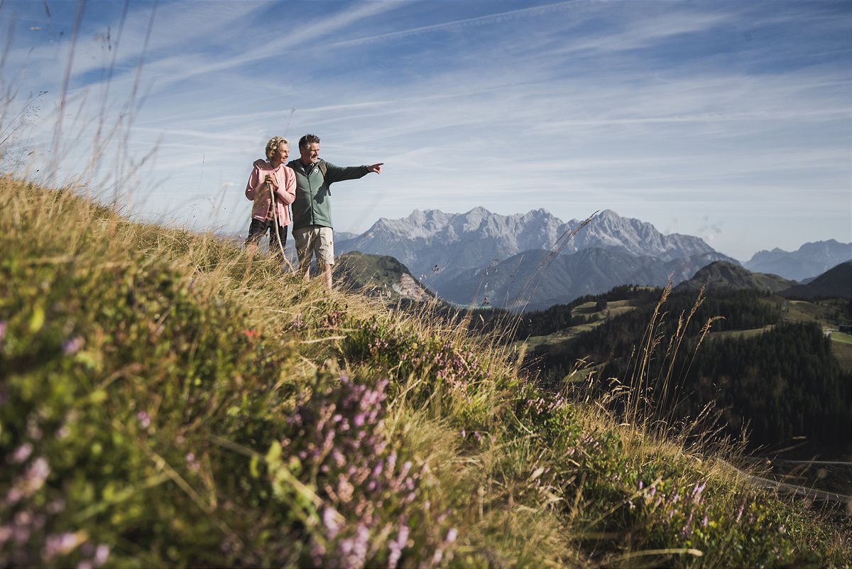 An older couple hiking in Saalbach in summer