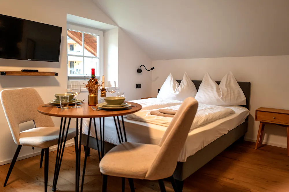 Studio apartment in dienten am hochkönig with comfortable bed and table, kitchen