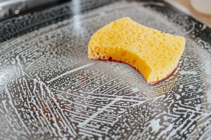 yellow sponge on cooktop