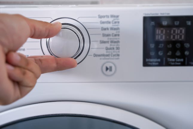 washing machine temperature being adjusted
