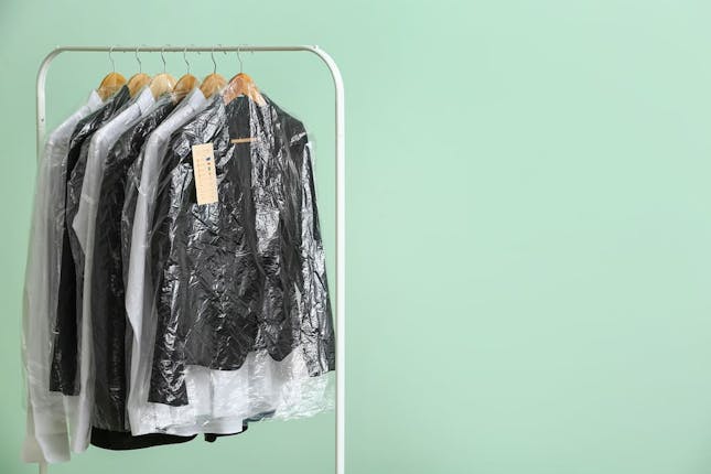Dry cleaning on pastel green background