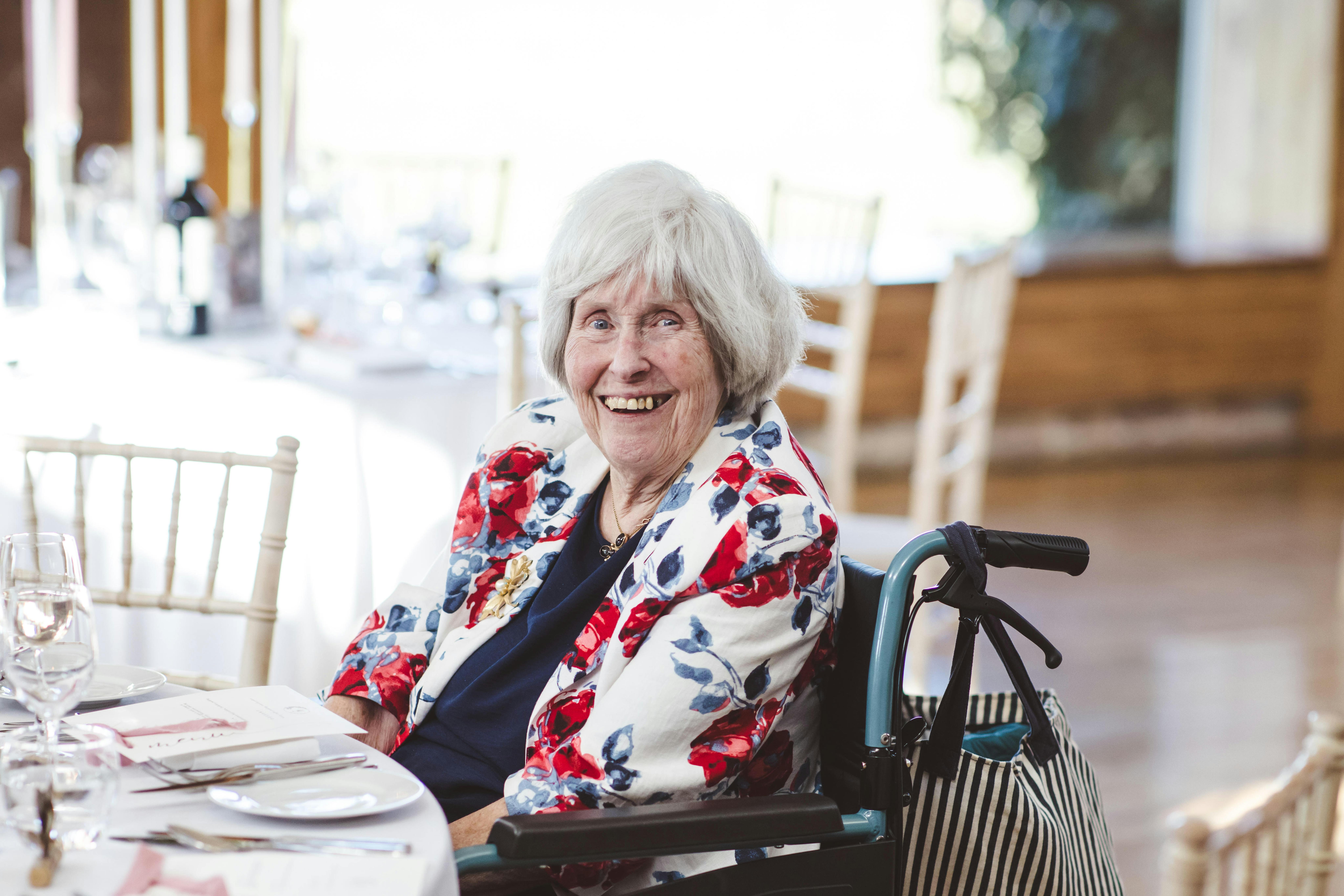 Happy elderly lady at wedding