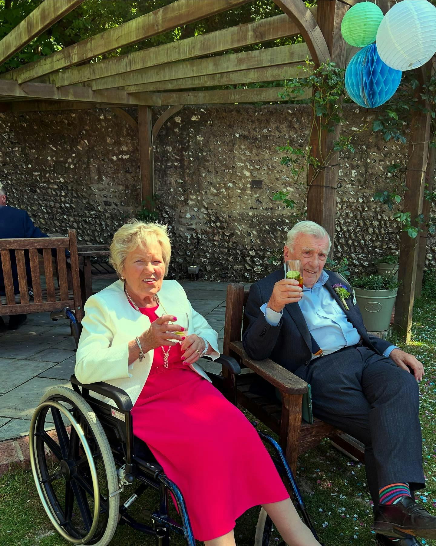 elderly couple enjoying wedding celebrations