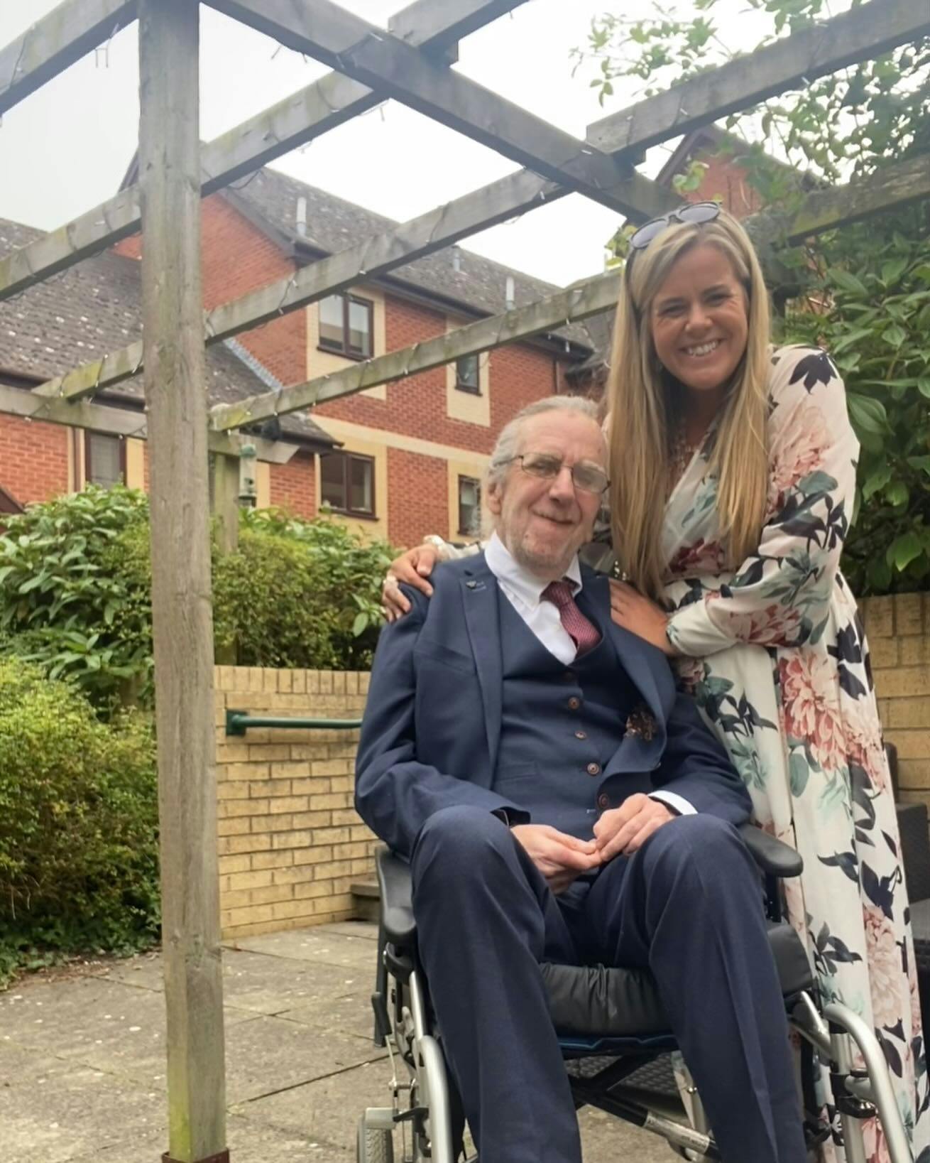 poppy providing care to elderly man at wedding