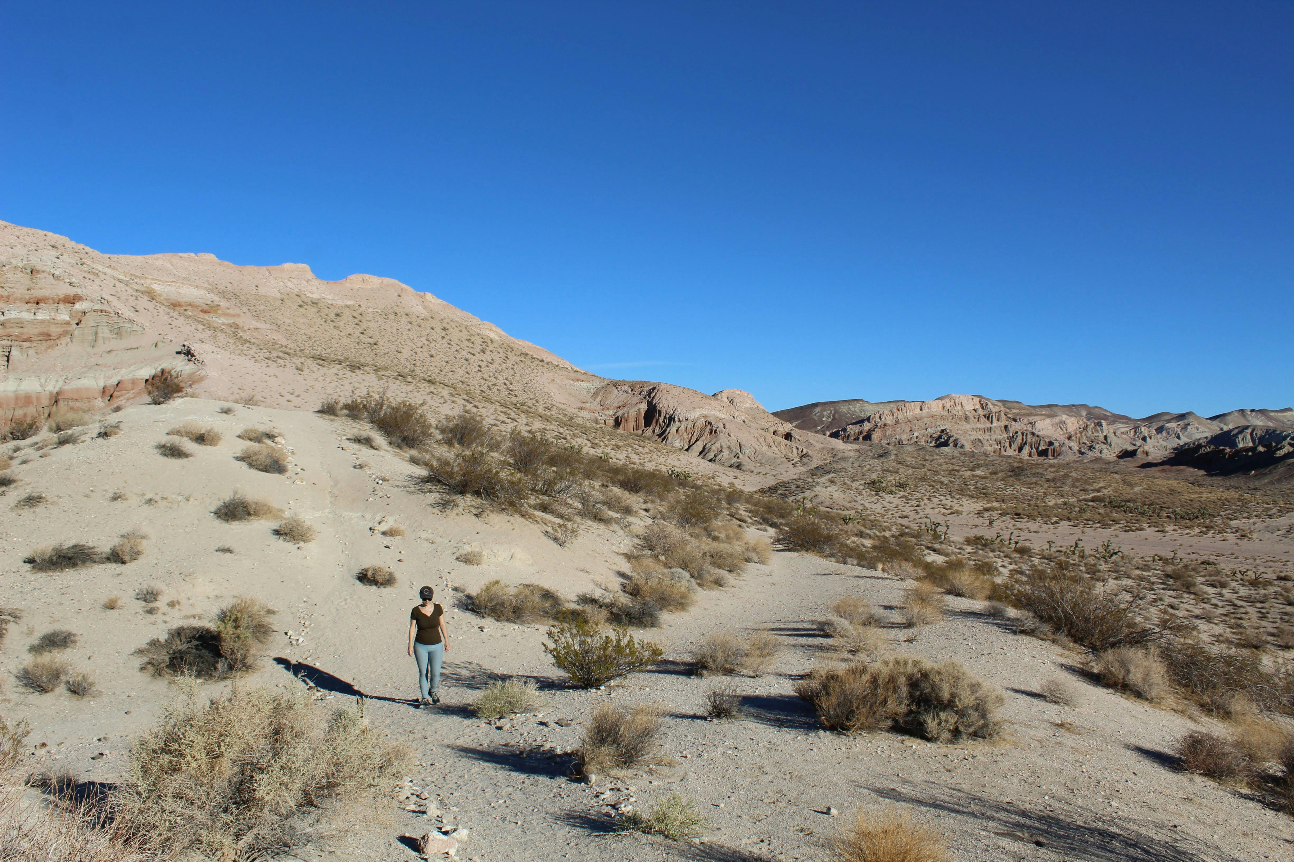 Hiker among wide open space at Red Rock Canyon State Park in California 