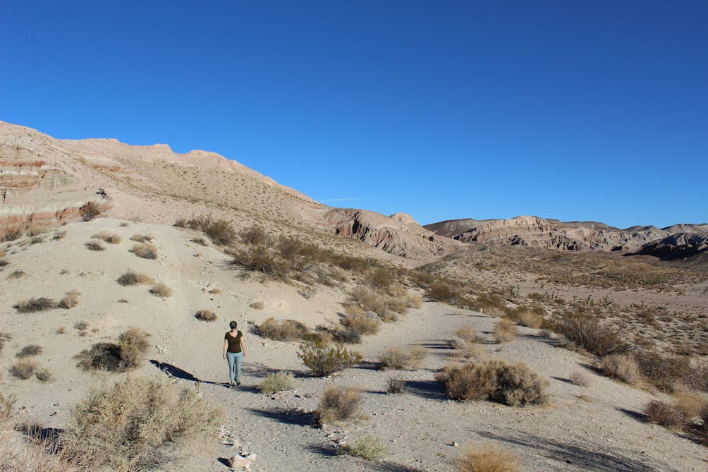 Hiker among wide open space at Red Rock Canyon State Park in California 