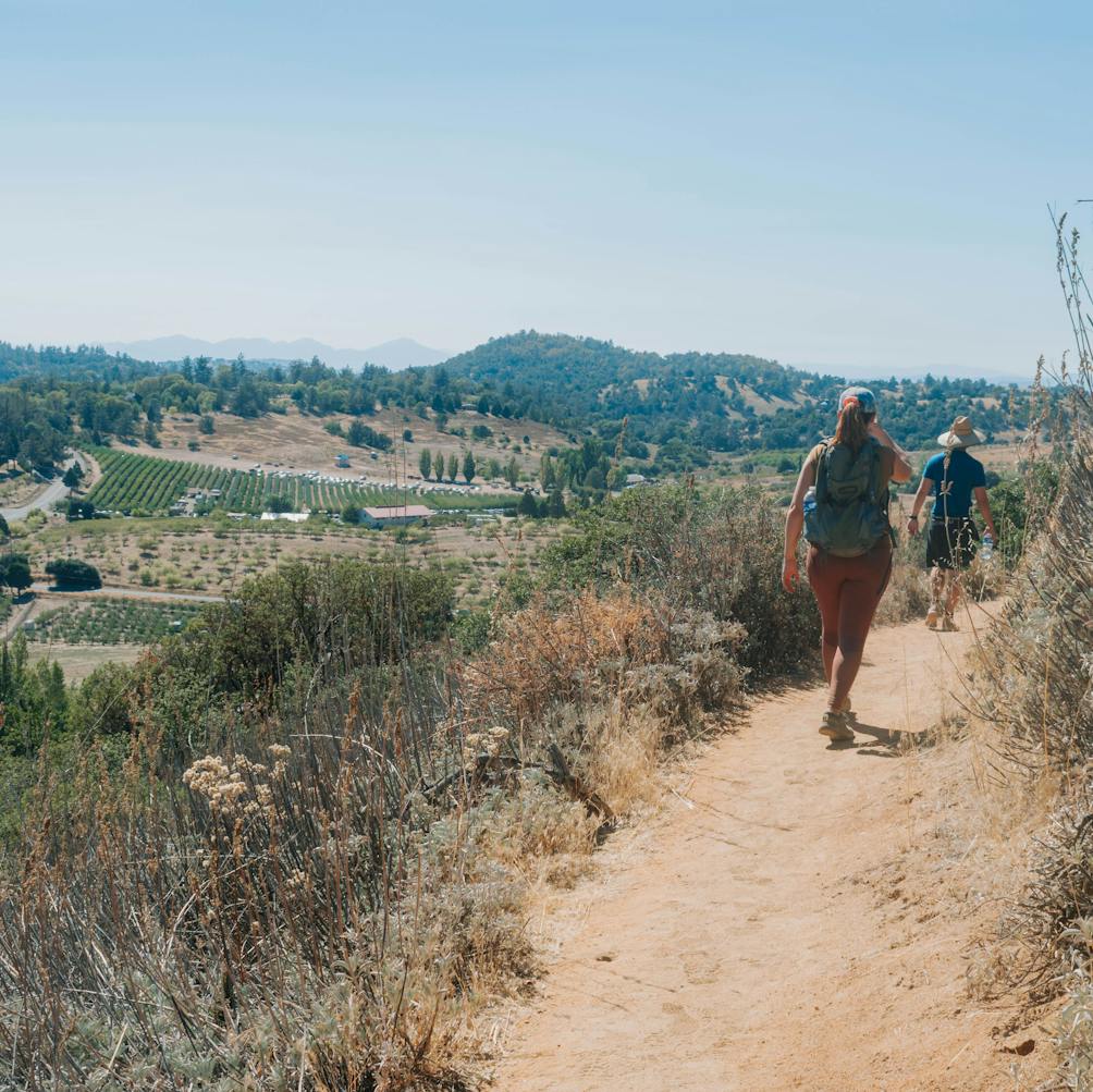 Hikers on a trail at Volcan Mountain Wilderness Preserve near Julian in San Diego County 