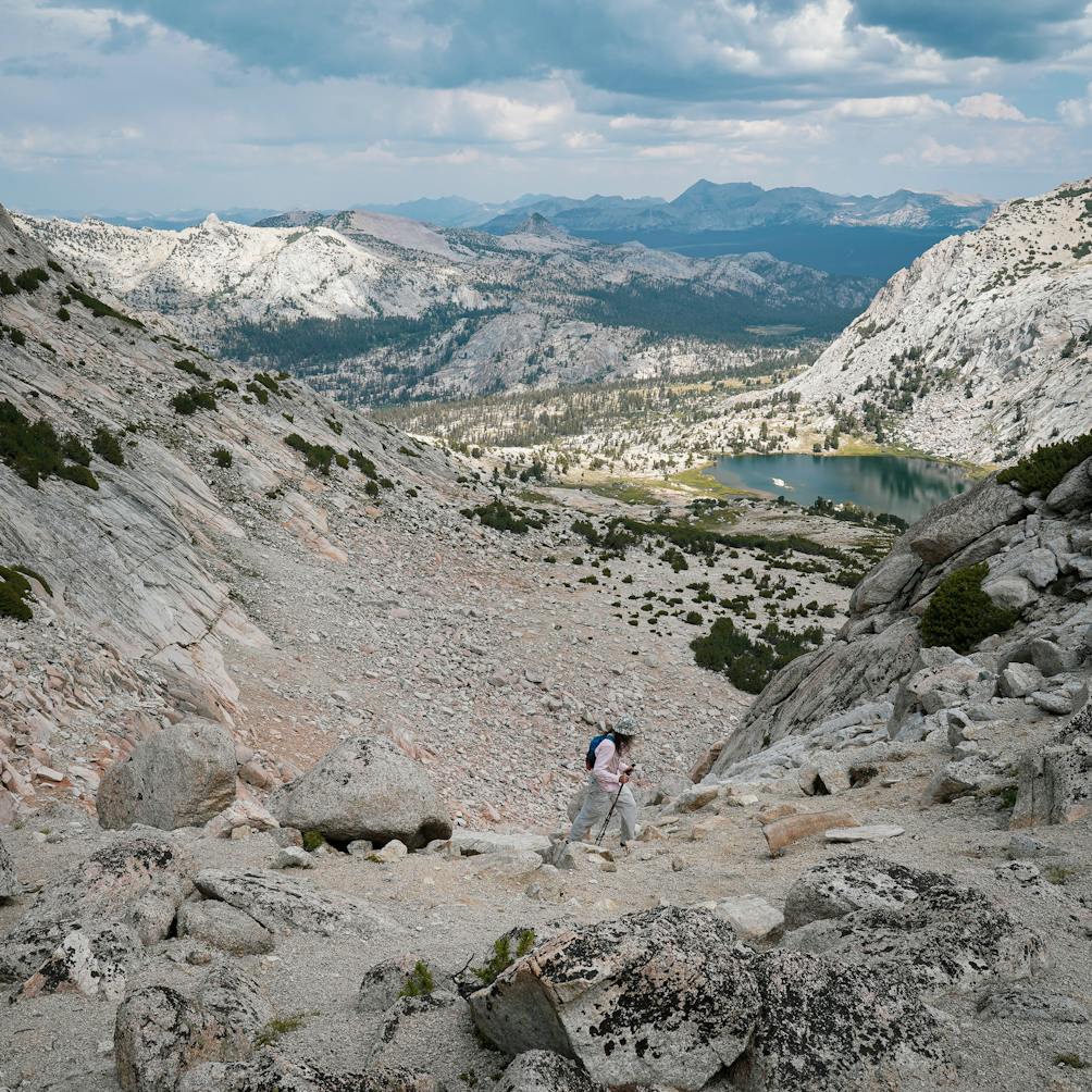 Hiker going up to Vogelsang Peak