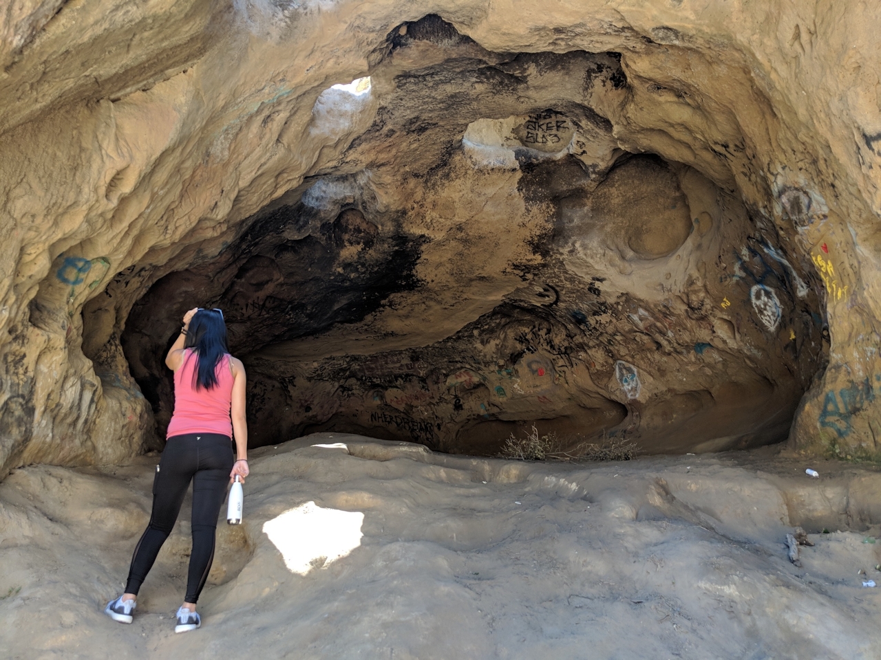 Hiker at Van Alden Cave in the Santa Cruz Mountains 