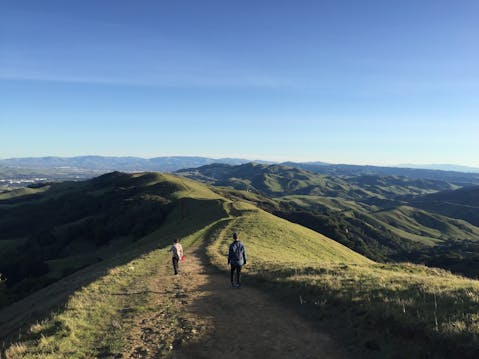Hikers on a ridge trail at Las Trampas Regional Wilderness in the East Bay