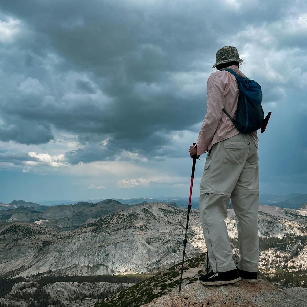 hiker at the summit of Vogelsang Peak in Yosemite