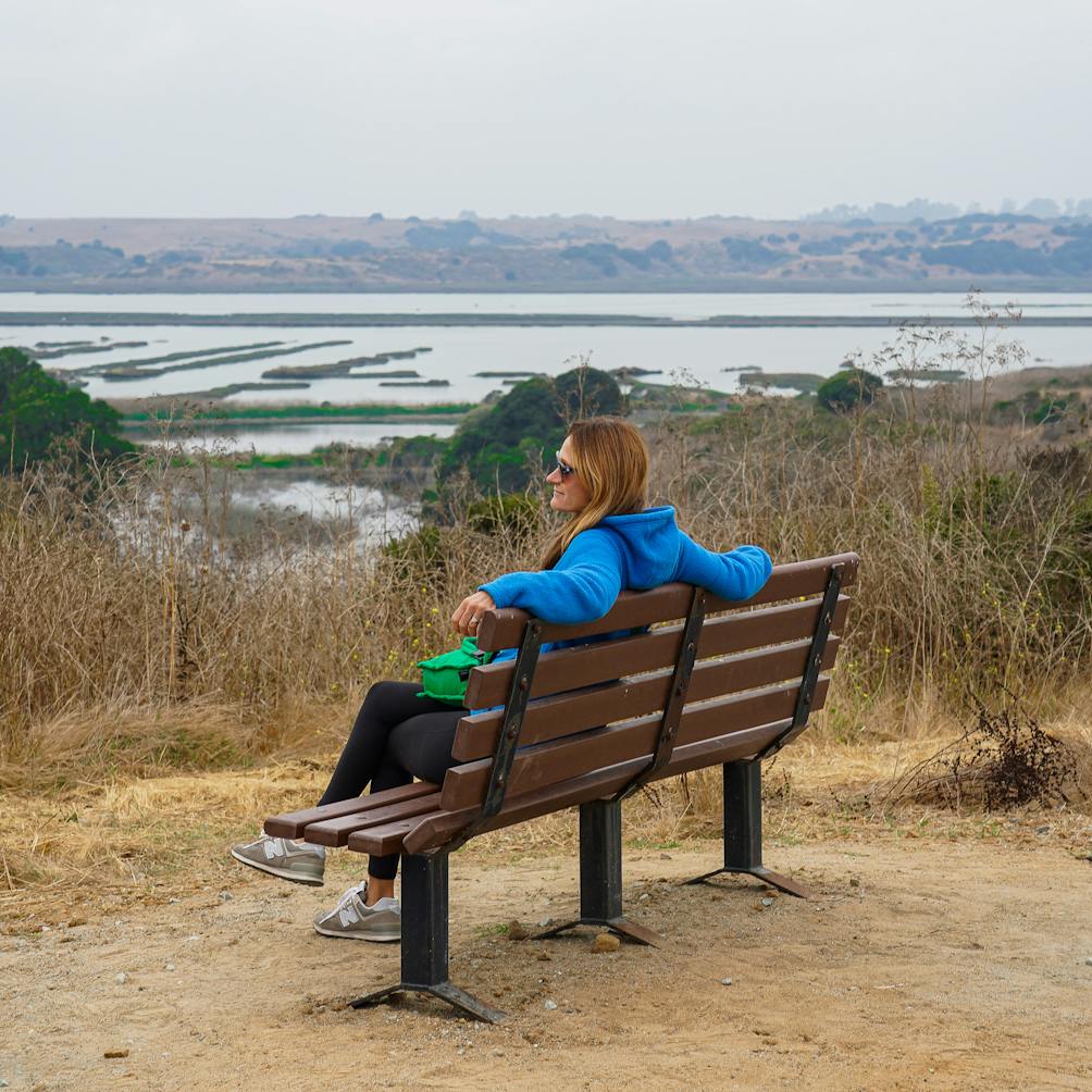 woman on bench at Elkhorn Slough Reserve