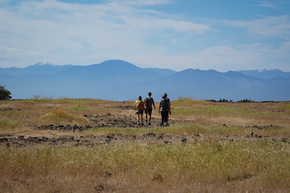 Hikers on the plateau of Upper Table Rock in Medford 