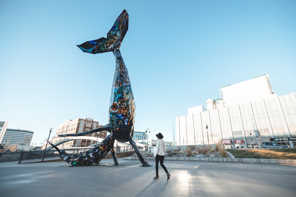 woman at Space Whale Burning Man art in Reno