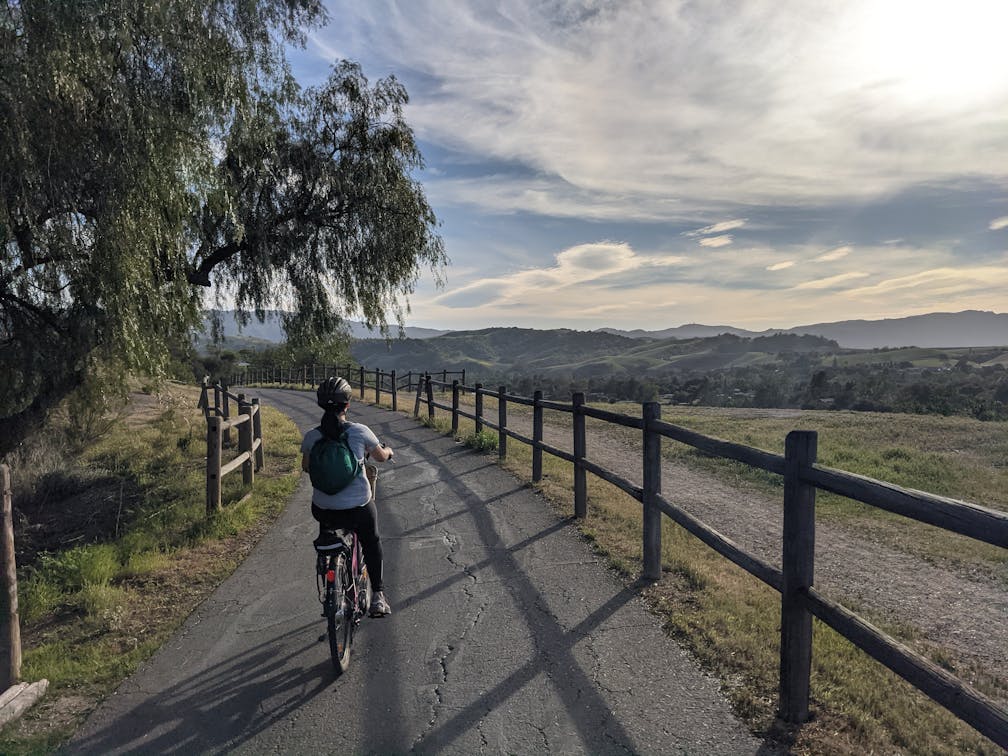 Woman biking the Ventura to Ojai bike path in Ventura County 