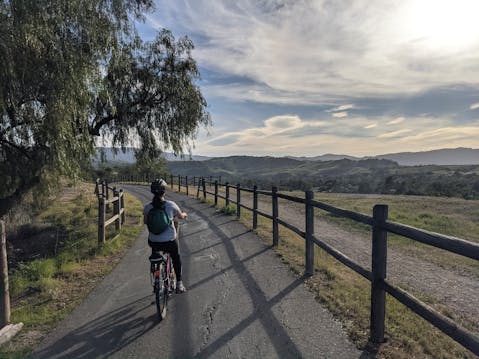 Woman biking the Ventura to Ojai bike path in Ventura County