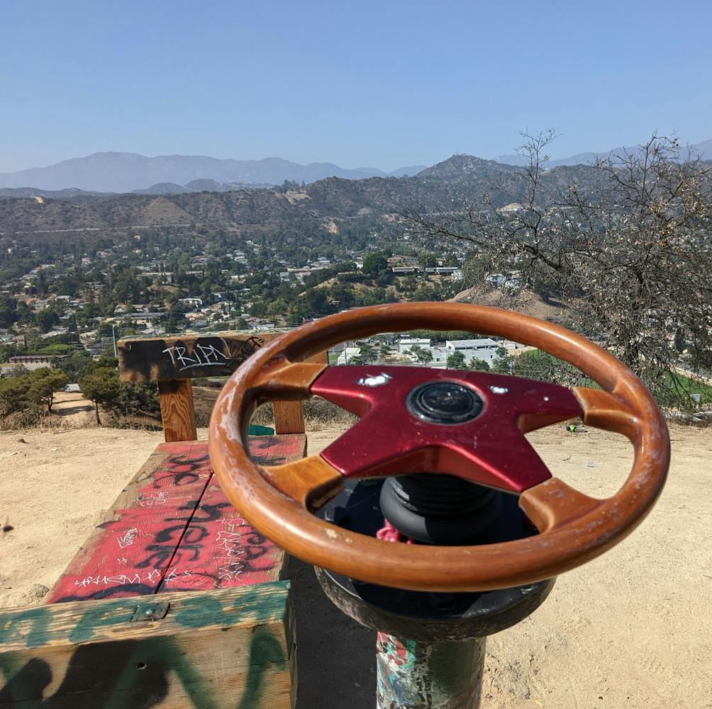 Bench and steering wheel at the top of Fiji Hill in Los Angeles 