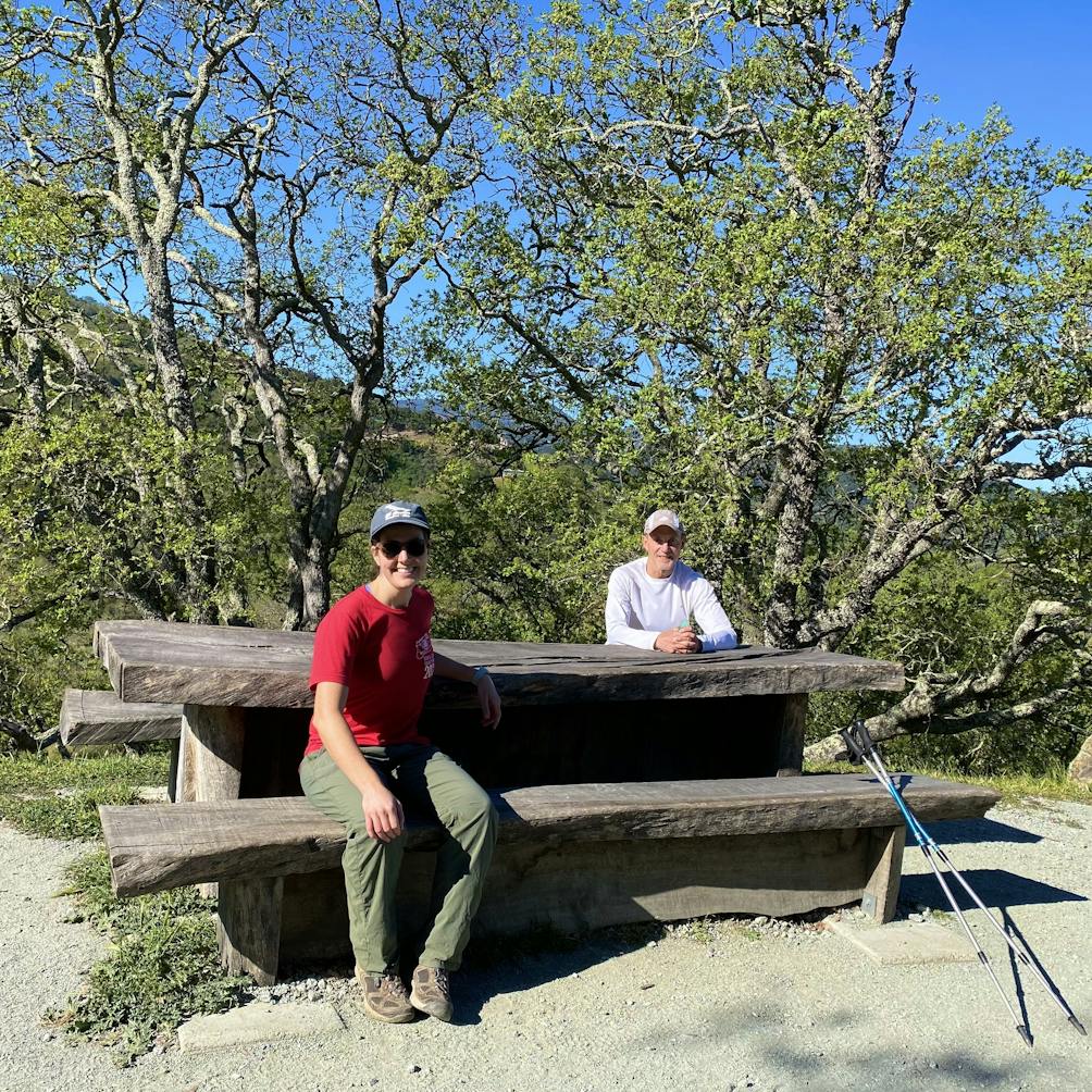 Two hikers taking a break at Lisa's Lookout picnic area at Calero County Park in the South Bay 