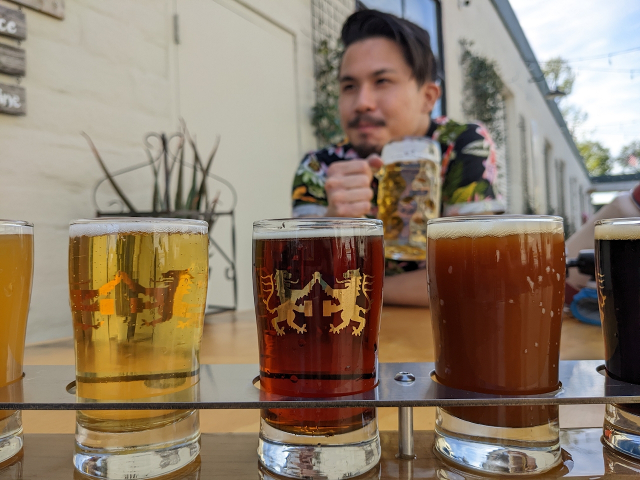 Person enjoying a beer at The Alley Moorpark