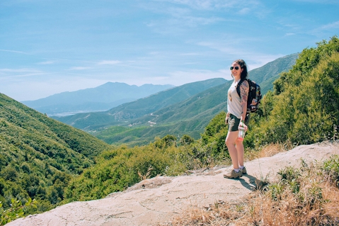Woman standing and overlooking the scenery at Marshall Peak in San Bernardino National Forest