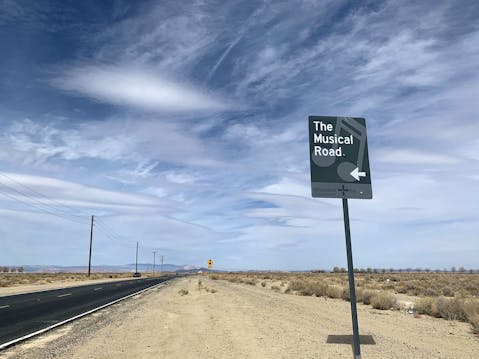 Sign reading The Musical Road and showing the road in Antelope Valley