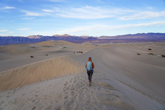 Woman on Mesquite Flat Sand Dunes at Death Valley National Park 