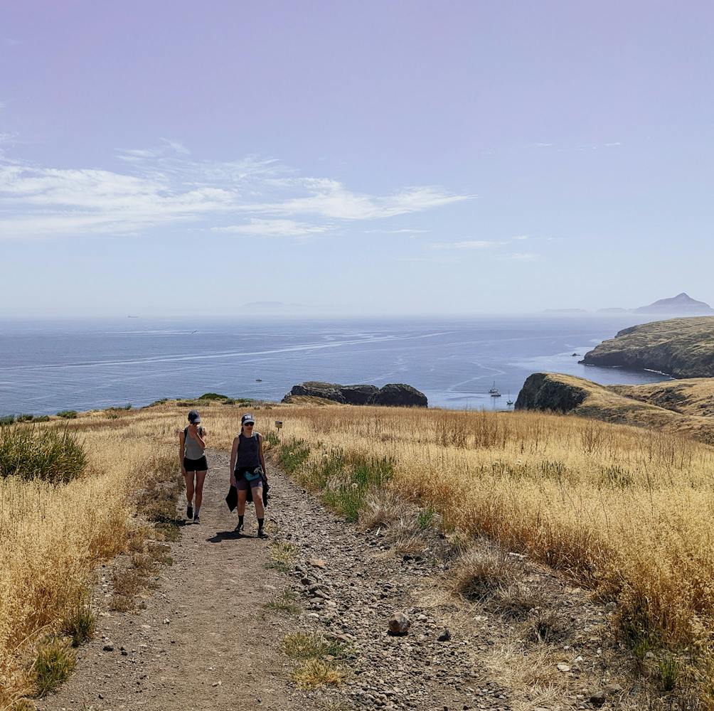 Two people hiking on Santa Cruz Island Channel Islands National Park 