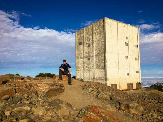 hiker at the summit of Mt Umunhum