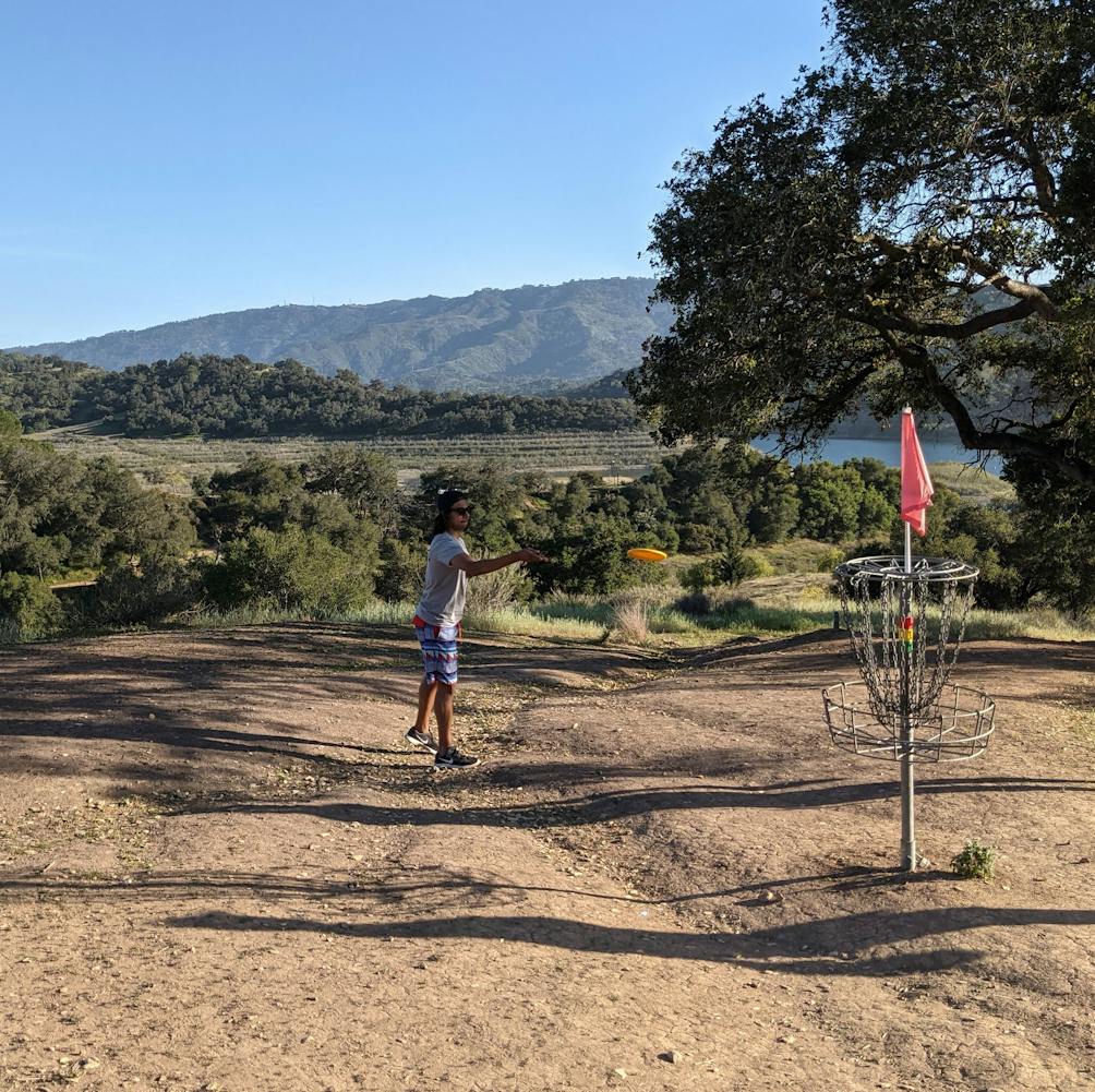 Person playing disc golf at Coyote Point Disc Golf Course at Lake Casitas Recreation Area near Ventura 